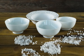 Bowls and sea salt scattered 
