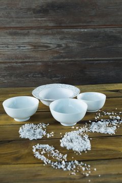 Bowls and sea salt scattered 