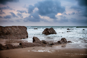 Sunset over Rocks at Widemouth Bay, Cornwall