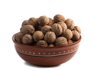 Ceramic bowl full of walnuts