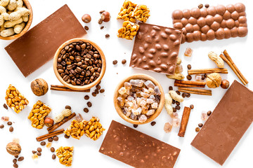 Ingredients for chocolates on white background top view