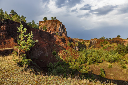 Abandoned career of red scorea rocks.
