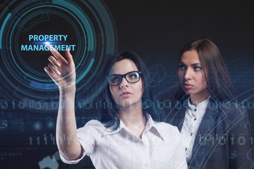 The concept of business, technology, the Internet and the network. A young entrepreneur working on a virtual screen of the future and sees the inscription: Property management