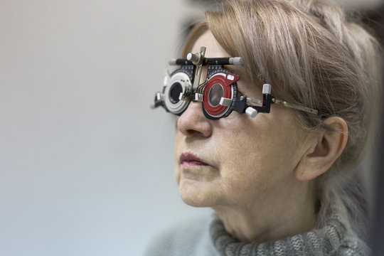 Woman wearing trial frame at ophthalmologist