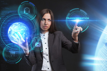 The concept of business, technology, the Internet and the network. A young entrepreneur working on a virtual screen of the future and sees the inscription: Transformation