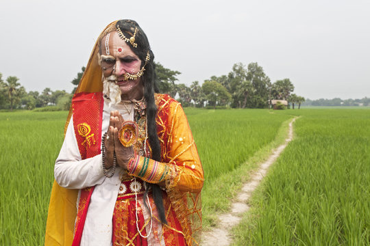 72 years old man decorating himself as ARDHYANARISWAR"(Half portion male and half portion female in one decoration)""2 years old man decorating himself as "ARDHYANARISWAR"(Half portion male and"" years old man decorating himself as "