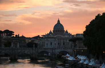 Fototapeta premium View of St. Peter's Basilica and the Tiber River at sunset, Rome, Italy