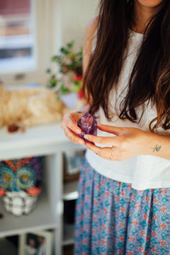 Woman holding crystal in her hands