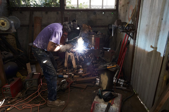 Metal worker in studio working