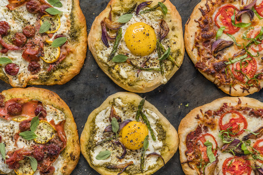 Close-up of rustic pizza and egg pizza