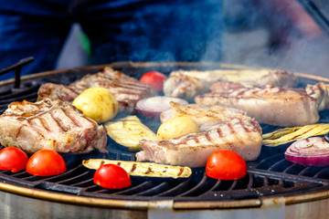 Meat, sausages and vegetables cooked on the grill. Barbecue.