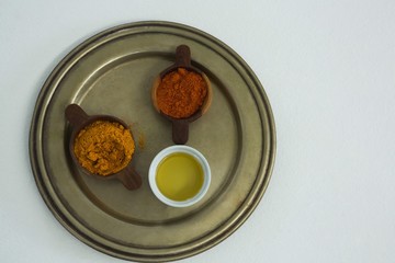 Spices powder with oil in bowl