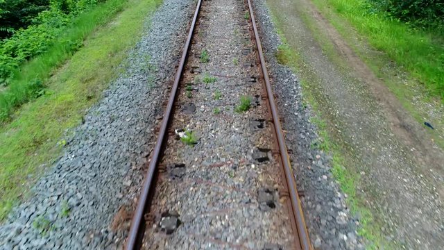 Aerial fast flight over railway tracks the track on railway or railroad also known as permanent way is structure consisting of rails fasteners railroad ties and ballast plus underlying subgrade 4k