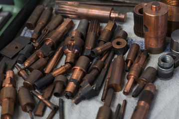 Metal copper workshop tools set on a table