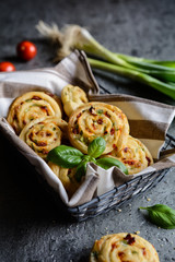 Vegetarian bread rolls filled with sun - dried tomato, green onion and Mozzarella