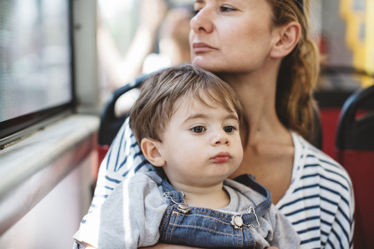 Mother with her son in a bus