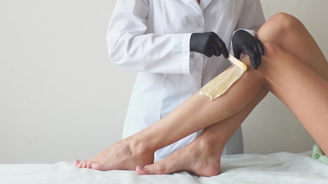 Sugar paste. Sugaring, depilation. Smooth skin legs.