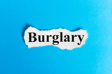BURGLARY text on paper. Word BURGLARY on a piece of paper. Concept Image.