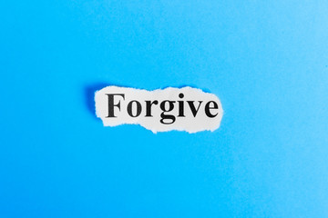 Forgive text on paper. Word Forgive on a piece of paper. Concept Image.