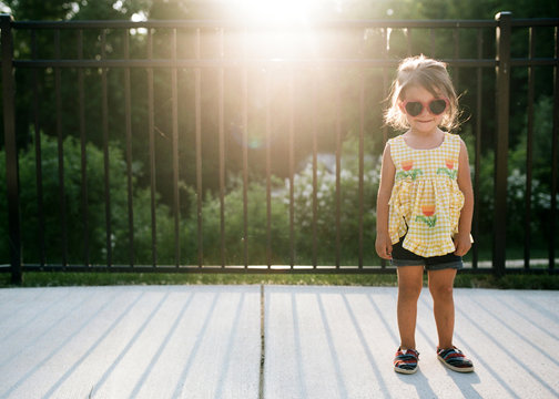 little girl in heart sunglasses