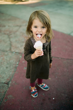 little girl eats ice cream