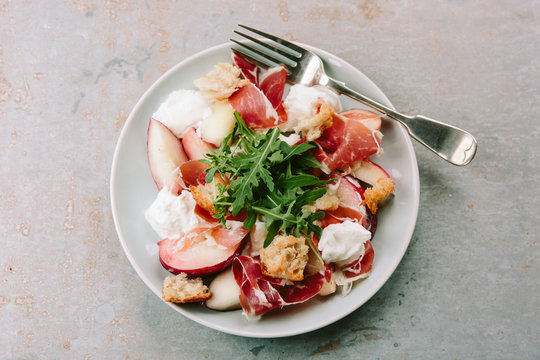 Burrata, peach and Iberico Ham salad.