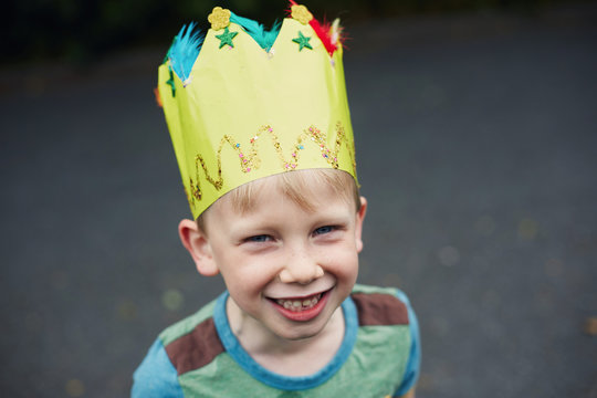 Happy smiling child wearing a crown