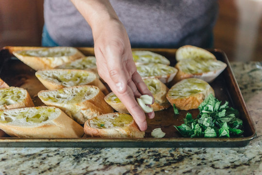 Preparing garlic bread for grill