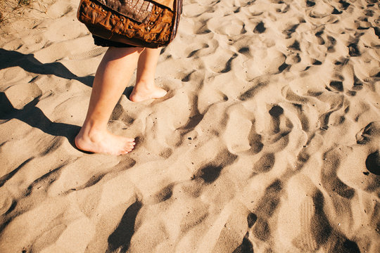 Walking barefoot on the sand