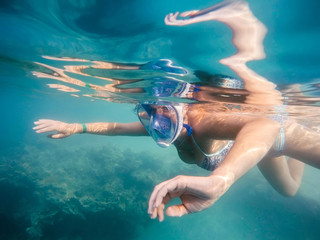 woman snorkel in shallow water