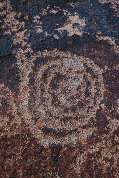 Close up of prehistoric petroglyph carvings on rock formations
