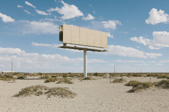 Empty billboard in desert,