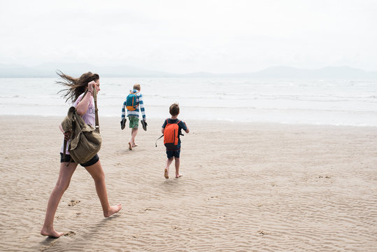 kids walking on the beach