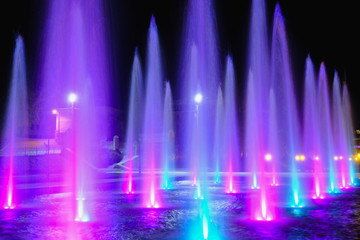 colored water fountain at night