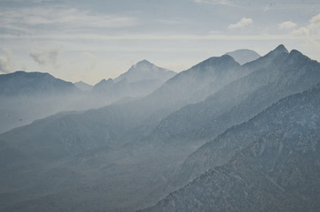 Mountain peaks in mist.