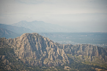 The mountain range in the haze in the West of Antalya city 8063.