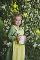 The child goes to water the garden 8277.