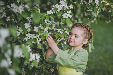 Little girl in the flowered garden 8329.