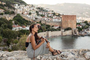traveller woman holding vintage camera