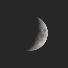 Obraz na płótnie Canvas Waning crescent moon seen with telescope