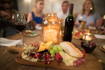 Various food and drink on dining table