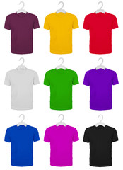 Set of nine colored cotton T-shirts on hangers, isolated on a white background