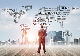 Motivation and inspiration concept with modern cityscape and businessman observing it