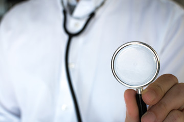 Doctor wearing his stethoscope