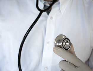Doctor wearing his stethoscope