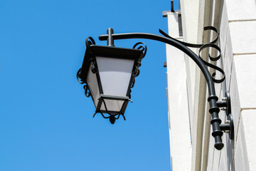 lantern on the wall of the house