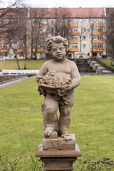 Portrait of a statue of a boy carrying flowers in the Public Koernerpark in Berlin Neukoell (ca 1914)