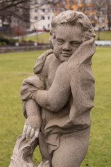 Portrait of a statue of a boy draped in a cloth in the Public Koernerpark in Berlin Neukoell (ca...