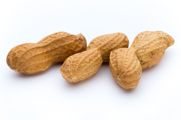 Dried peanuts on the white background.