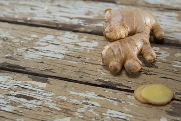 Close up of ginger on weathered table